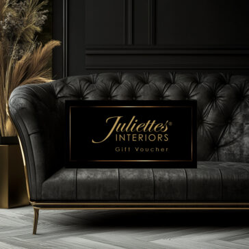 Juliettes Interiors Gift Voucher Juliettes Interiors luxury gift voucher on a black tufted sofa