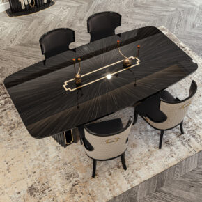 A sleek black dining table with a decorative center strip is surrounded by four sophisticated chairs on a patterned rug. The room features elegant design elements, including a textured wooden floor.