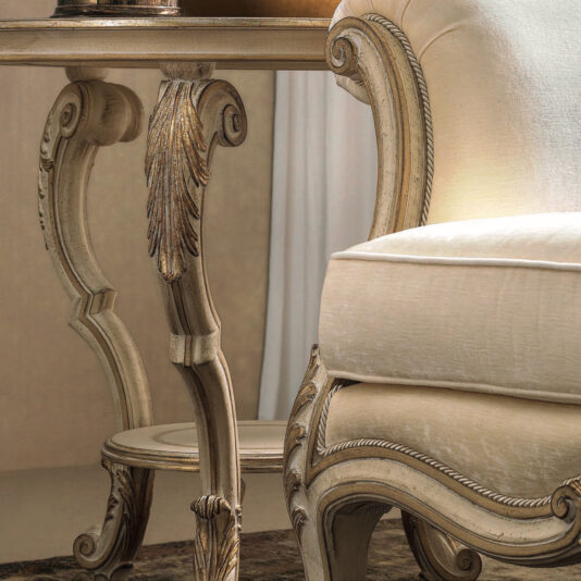 A close-up of elegant furniture showcases the Ornate Luxury Rococo Style Sofa, adorned with intricate wood carvings. The scene exudes luxury, framed by a soft, neutral backdrop that accentuates its sophisticated design elements.
