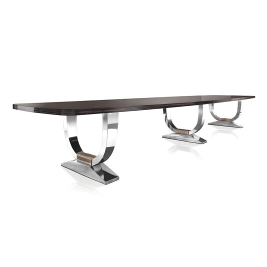 The Large Italian Dining Table showcases a contemporary design with its sleek, rectangular dark wooden top stretching six metres, supported by three glossy silver U-shaped bases. It's an ideal piece for any modern dining area.