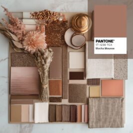A flat lay of various textured and coloured materials, including Mocha Mousse, showcases Pantone 17-1230 TCX. The collection includes fabric swatches, dried flowers, wood, and sparkly elements in earthy, neutral tones.