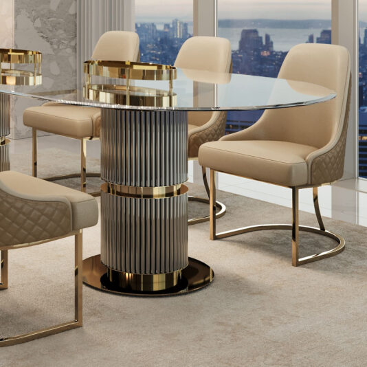 Modern Two-Tone Dining Chair A luxurious dining room features a round glass table with a metal column base, complemented by Modern Two-Tone Dining Chairs upholstered in beige with gold accents. The beige carpet and large windows offer stunning city skyline and water views.