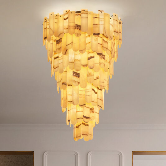 The Modern Onyx Chandelier features layers of translucent amber panels in a cascading, tiered design. It provides warm illumination that accentuates the unique patterns and textures against a minimalist white ceiling.