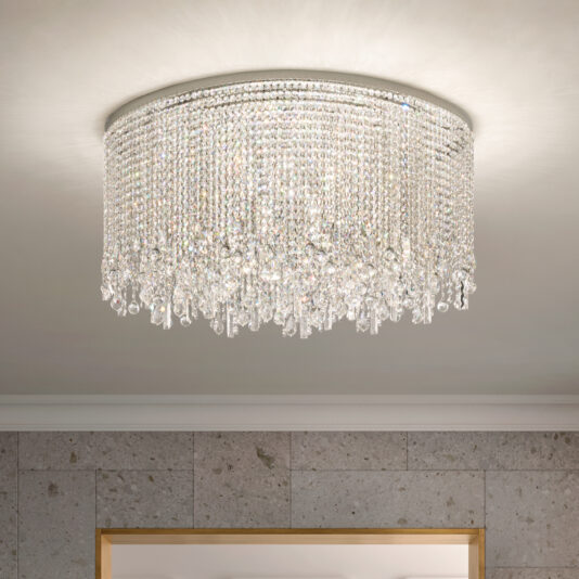 A Rectangular Smoked Cut Crystal Ceiling Light enhances the white ceiling, casting reflections from its many crystals. The light gray, subtly textured walls complement a partially visible wooden frame at the bottom.