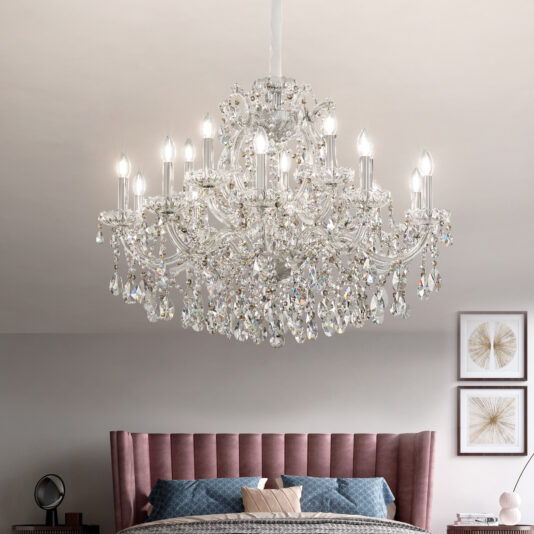 The Classic Style Tiered Crystal Chandelier hangs above a pink tufted headboard bed in a modern bedroom, softly lit and decorated with framed art on the wall.