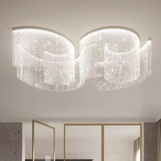 The Large Statement Cut Crystal Ceiling Light features wave-like cut crystal strands creating an elegant, dazzling effect. It's mounted on a white ceiling above a gold-framed glass door.