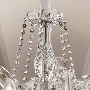 Close-up of the Large Classic Style Crystal Chandelier, featuring intricate glass patterns and dangling beads that reflect light and create a sparkling effect.