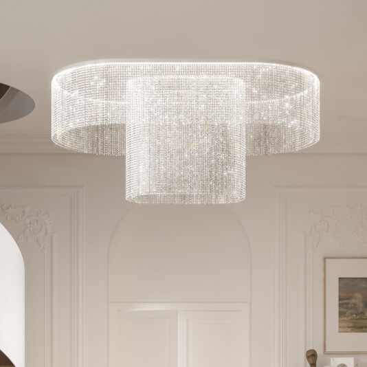 A luxurious Curved Cut Crystal Ceiling Light features two concentric circles of shimmering crystals, enhancing the room's opulent ambiance, alongside elegant molding and a framed painting on the wall.