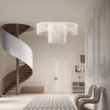 An elegant space features the Large Oval Cut Crystal Ceiling Light, illuminating a spiral staircase and ornate walls. Two modern chairs are near a decorative cabinet, with a patterned rug partially covering the light-colored floor.