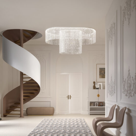 Large Oval Cut Crystal Ceiling Light An elegant space features the Large Oval Cut Crystal Ceiling Light, illuminating a spiral staircase and ornate walls. Two modern chairs are near a decorative cabinet, with a patterned rug partially covering the light-colored floor.