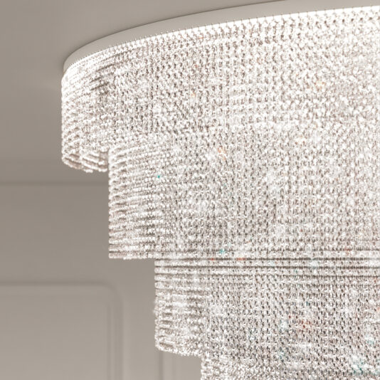 A close-up of the Large Oval Cut Crystal Ceiling Light displays cascading layers of sparkling crystals reflecting light in multiple directions against a softly blurred background, enhancing its shimmering, ornate chandelier design.