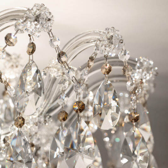 Close-up of the Round Crystal Ceiling Light featuring clear and amber beads with teardrop-shaped crystal pendants, reflecting light to create sparkling highlights.