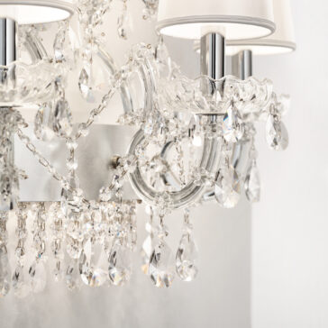 Close-up of the Classic Style Clear Crystal Chandelier (Copy) featuring sparkling glass pendants, elegant curved arms, and white fabric lampshades for a luxurious and sophisticated look.