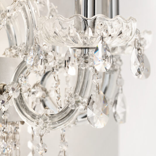 Close-up of the Classic Style Clear Crystal Chandelier (Copy) with glass arms, teardrop crystals, and faceted beads that reflect light to create sparkling highlights.