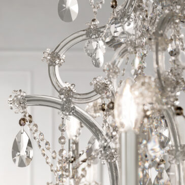 A close-up of the Classic Style Empire Crystal Chandelier reveals sparkling glass beads, ornate curved arms, and teardrop crystals that reflect light and create an elegant, luxurious ambiance.