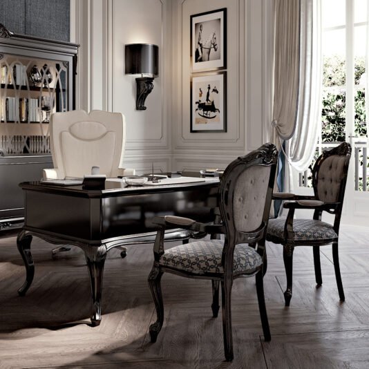 Elegant home office with a High End Leather Swivel Office Chair, ornate black desk, and two carved wood chairs. French doors provide natural light; framed art and a display cabinet add to the sophisticated classic decor.