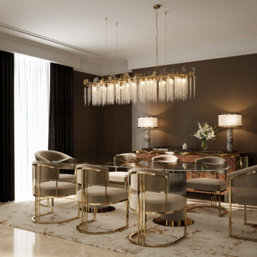 Contemporary Leaf Chandelier With Crystal Drops Elegant dining room with gold and beige chairs around a glass table, featuring the Contemporary Leaf Chandelier With Crystal Drops, a patterned rug, floor-to-ceiling curtains, and a sideboard decorated with flowers and two lamps.