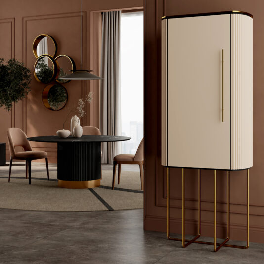 A modern dining room with the Round Contemporary Marble Effect Dining Table, pink chairs, and circular mirrors on a brown wall. A tall cream cabinet with gold legs stands to the right, while large windows with curtains brighten the space.