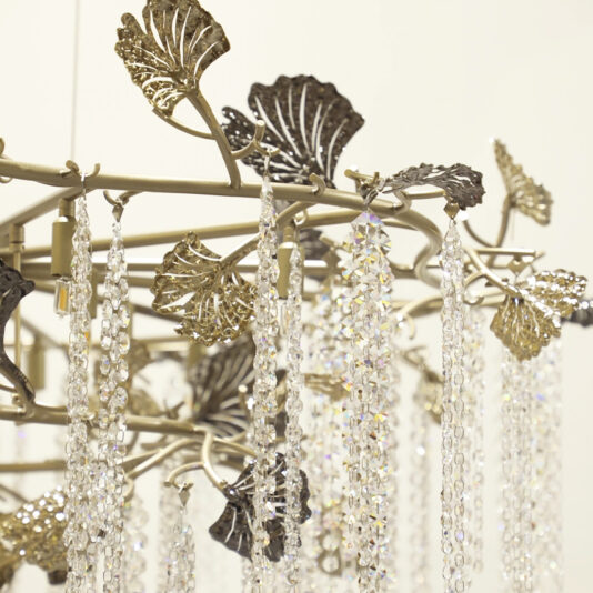 Large Leaf Chandelier With Crystal Drops A close-up of the Contemporary Leaf Chandelier With Crystal Drops (Copy), showcasing sparkling crystal strands and metallic leaves against a light background for an elegant, sophisticated look.