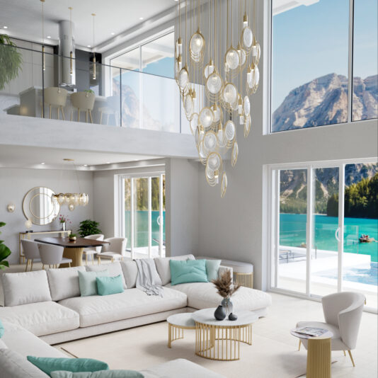 A modern, spacious living room with large windows overlooks a mountain lake. The Modern Round Chandelier Inspired By The Sea (Copy) hangs from the high ceiling, while white sofas with mint pillows and gold-accented tables brighten the space.