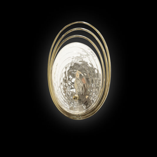 The Modern Ceiling Light Inspired By The Sea features a textured transparent glass dome and three gold metal rings, casting a warm glow against a gray wall.