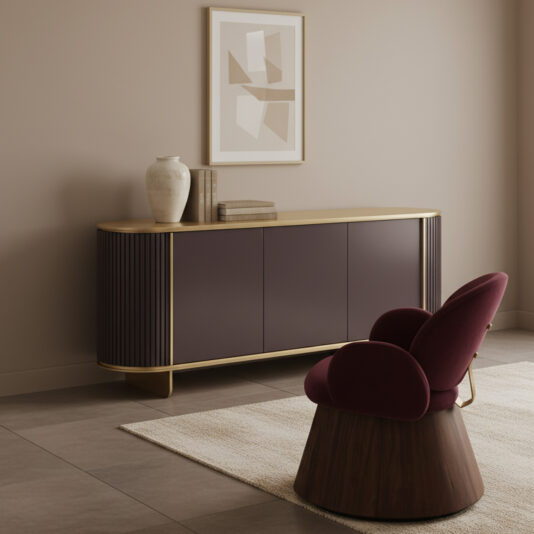Contemporary Lacquered Curved Sideboard A minimalist room includes a Contemporary Lacquered Curved Sideboard in dark mauve, books, a vase, abstract art on the wall, and a modern burgundy chair with a wooden base placed on a light rug over tiled flooring.