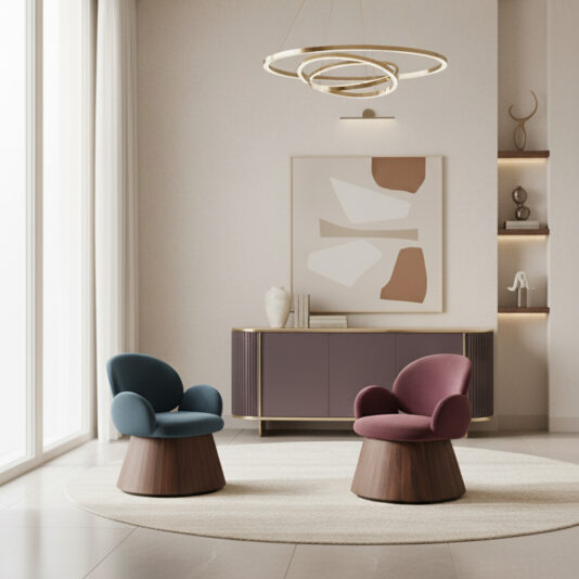 Contemporary Lacquered Curved Sideboard A modern living room features blue and pink velvet chairs on a round rug. Abstract art hangs above a Contemporary Lacquered Curved Sideboard, which displays decor on its shelves. Circular pendant lights illuminate the space.