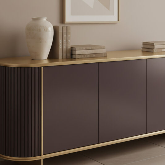 Contemporary Lacquered Curved Sideboard The Contemporary Lacquered Curved Sideboard features dark purple doors and gold trim, accented with a white vase and neutral books on top, set against a beige wall under a framed abstract artwork.