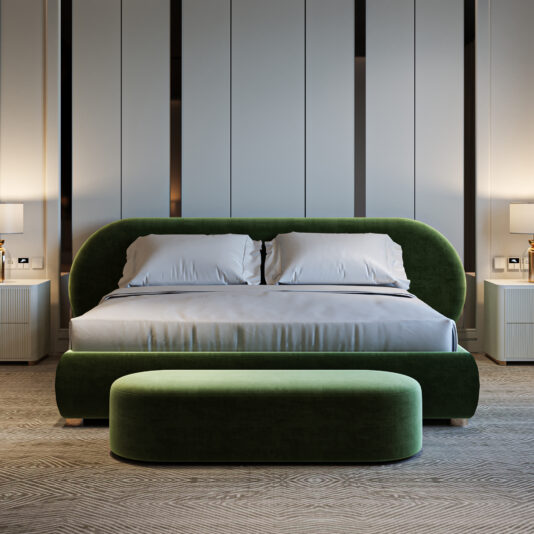 A modern bedroom with the Curved Contemporary Upholstered Bed (Copy) in green velvet, a matching bench, white bedding, two bedside tables with lamps, and a minimalist neutral-colored wall background.