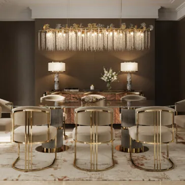 Modern Oval Glass Dining Table A luxurious dining room features the Contemporary Oval Glass Dining Table, eight gold and beige chairs, a modern crystal-accented chandelier, two table lamps, a wooden sideboard, and a vase of white flowers against dark brown walls.