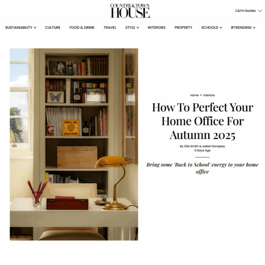 Article on Country & Town House titled How to perfect your home office for autumn 2025. An image shows a tidy home office with a wooden desk, white chair, and bookshelves filled with books and decor. Sunlight streams through a window with a leafy view.