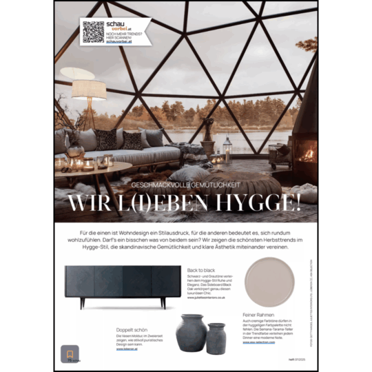 A stylish living room with modern furniture, warm lighting, decorative objects, and a geometric dome window overlooking a lake and trees, promoting a cosy autumn atmosphere in hygge style.