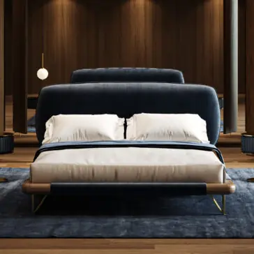 Contemporary High End Italian Bed A modern bedroom showcases the Contemporary High-End Italian Bed in navy blue upholstery with a wooden frame and gold accents, paired with white bed linen. Wood-panelled walls, mirrors, soft lighting, and a blue rug complete the space.