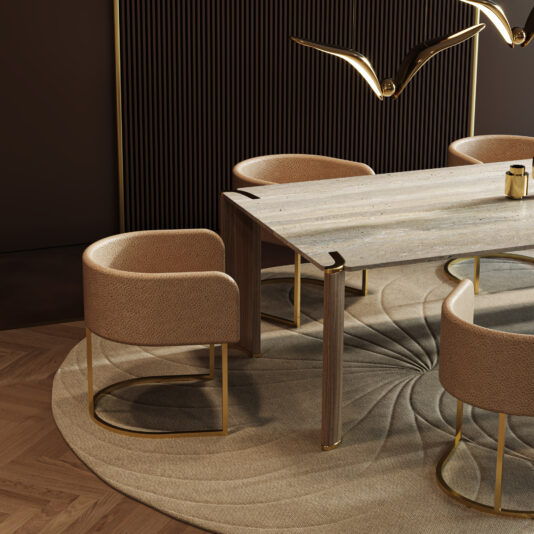 Contemporary Rectangular Stone Dining Table A modern dining area features a Contemporary Rectangular Stone Dining Table, four beige upholstered chairs with gold legs, a round textured rug, and a gold bird-shaped ceiling light set against a dark ribbed feature wall.