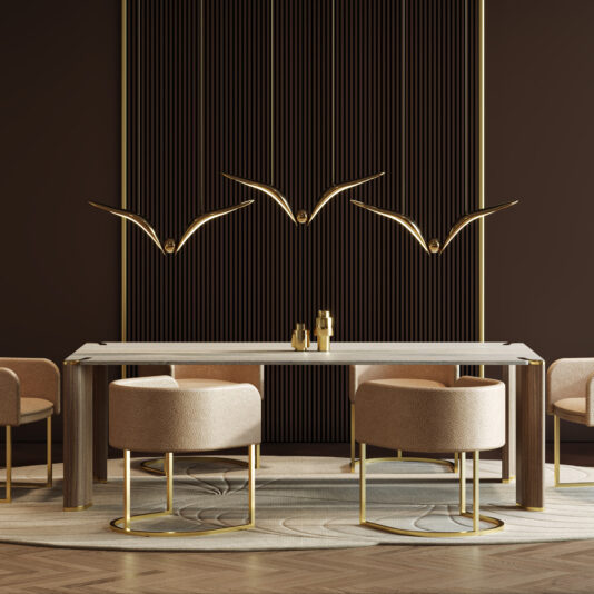 A modern dining room showcases beige chairs and the Contemporary Rectangular Stone Dining Table, enhanced by sleek gold accents and three gold bird sculptures on a dark, vertically striped wall for an elegant, minimalist look.