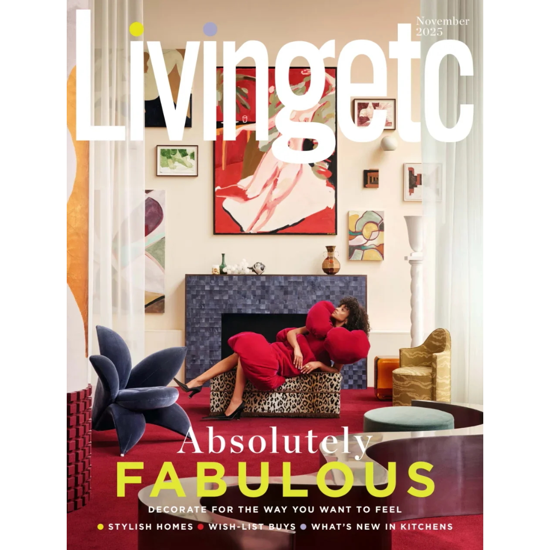 A woman in a red dress lounges on a leopard-print sofa in a colourful, modern living room with bold artwork, vibrant decor, and glossy magazines; "Livingetc" magazine cover, November 2023 issue.