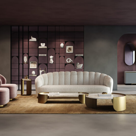 Contemporary Faux Marble Coffee Tables A modern living room with a textured white sofa, a mauve armchair, and decorative shelves displaying art and ceramics, anchored by Contemporary Marble Coffee Tables. The space showcases muted tones and sleek, contemporary style.