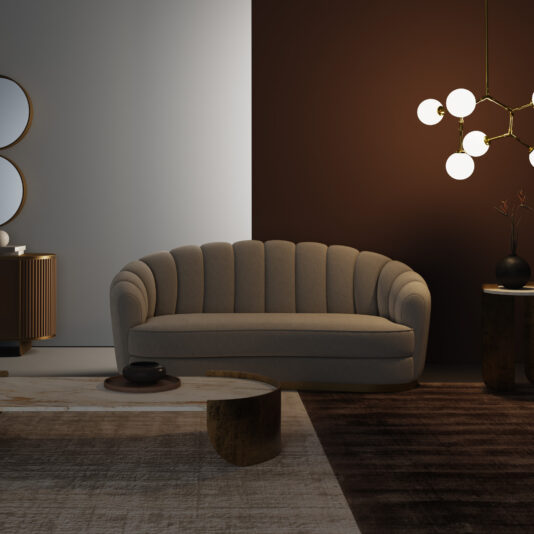 A modern living room featuring a Large Modern Bouclè Sofa with a shell shape, a two-tone white and brown wall, round coffee table, dark area rug, and a gold chandelier with globe lights.