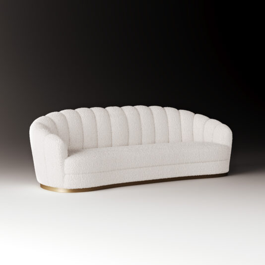 The Large Modern Velvet Sofa, featuring a curved scalloped backrest and gold base, stands out against a gradient background fading from dark to light.