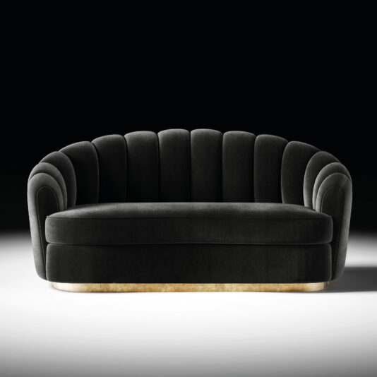 The Modern Velvet Sofa in black showcases a luxurious design with a scalloped shell-like backrest, rounded armrests, and a golden base, set against a plain black background.