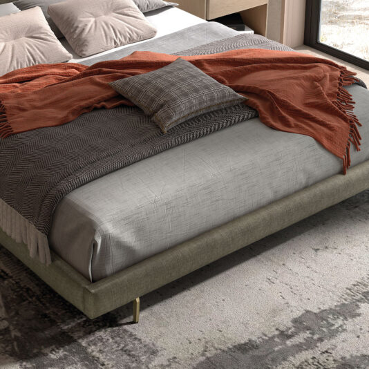 Contemporary Bed With Backlit Headboard The Contemporary Bed With Backlit Headboard is dressed in grey bedding, a patterned cushion, and a burnt orange throw. Its upholstered frame sits atop a textured area rug in this sunlit room.