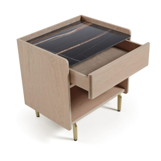 Contemporary Bedside With Porcelain Marble Top The Contemporary Bedside With Porcelain Marble Top features a light wood finish, gold legs, an open bottom shelf, a partly opened drawer, and a porcelain marble surface with elegant brown and white veining.