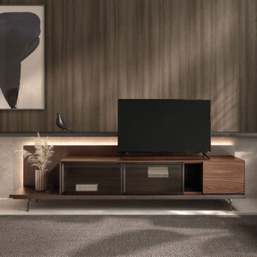 A modern living room featuring a Modern Walnut Veneer TV Cabinet with a flat-screen telly, black bird sculpture, pampas grass, large abstract art piece, and soft ambient lighting.