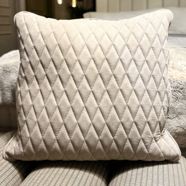 The Set of 4 Quilted Nubuck Scatter Cushions features square beige cushions with a diamond quilted pattern, ideal for adding cosy elegance to any space.