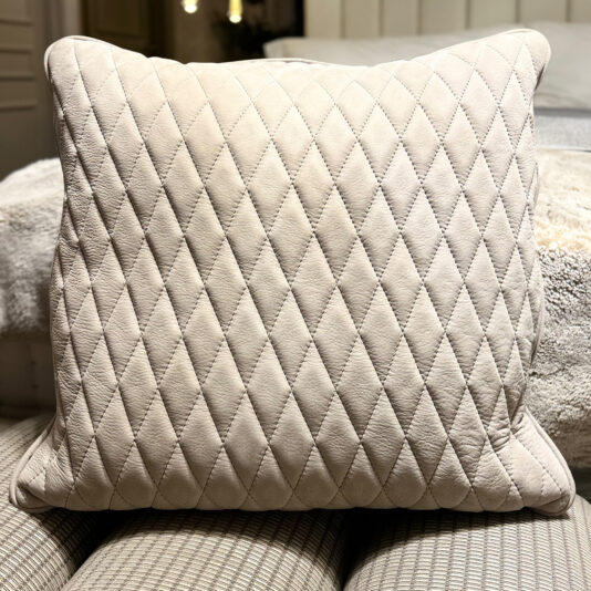 Set Of 4 Quilted Nubuck Scatter Cushions The Set of 4 Quilted Nubuck Scatter Cushions features square beige cushions with a diamond quilted pattern, ideal for adding cosy elegance to any space.