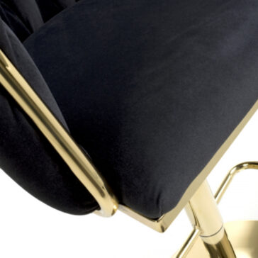 Set of 2 Woven Velvet Black Swivel Bar Stools Close-up of the Set of 2 Woven Velvet Black Swivel Bar Stools, showing the soft black cushion, shiny gold frame, seat, partial backrest, and armrest.