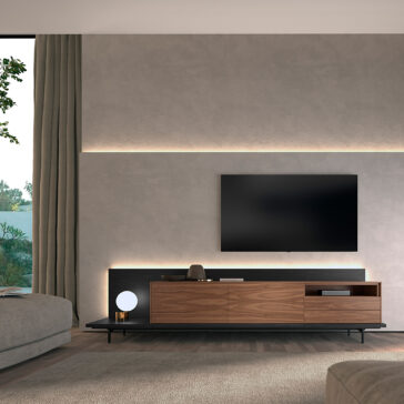 Walnut Veneer Media Sideboard A modern living room with a wall-mounted TV, Walnut Veneer Media Sideboard, black accents, a small lamp, minimalist decor, soft beige walls, ambient lighting, a large window with beige curtains, and part of a grey sofa.