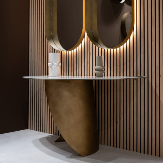 Contemporary Marble Console Table A modern entrance displays the Modern Marble Console Table with a curved gold base, paired with two abstract vases and two backlit oval mirrors on a vertical wooden slat wall.