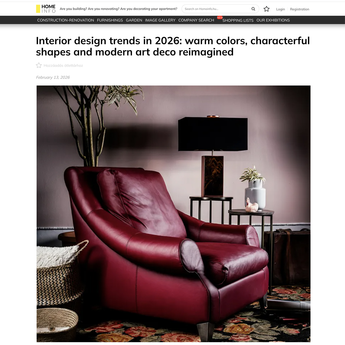 A stylish room featuring a deep red leather armchair, a black side table with books, a potted plant, and a modern floor lamp against a muted purple wall with warm lighting.