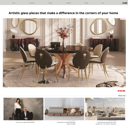 A luxurious dining room with a round glass table, six upholstered chairs with gold accents, and elegant decor including vases, mirrors, and wall art. Below are three articles with preview images and titles.